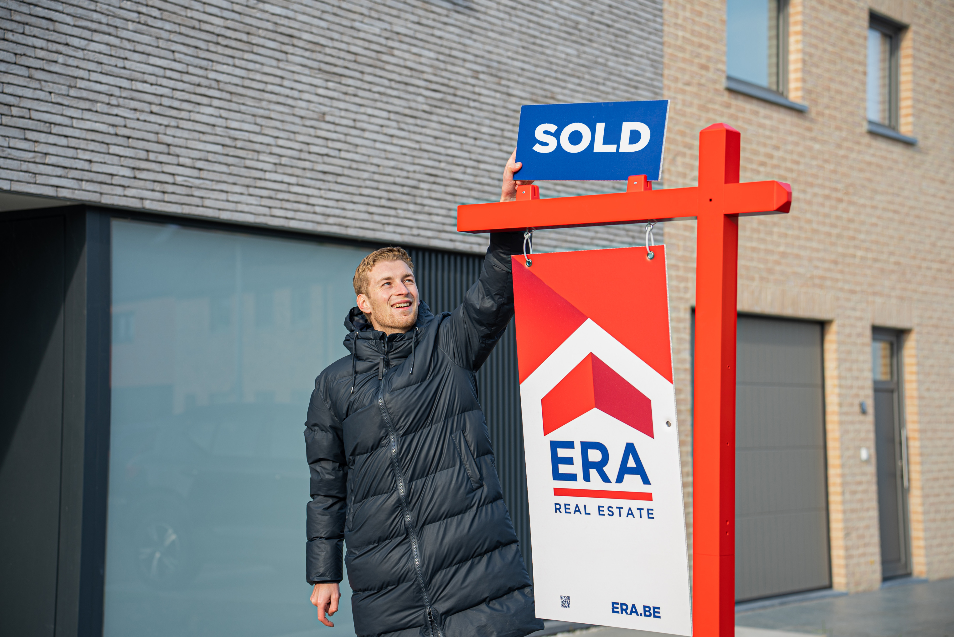 ERA estate agent with sold sign
