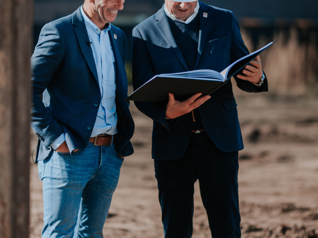 Real estate agent on a new construction project site